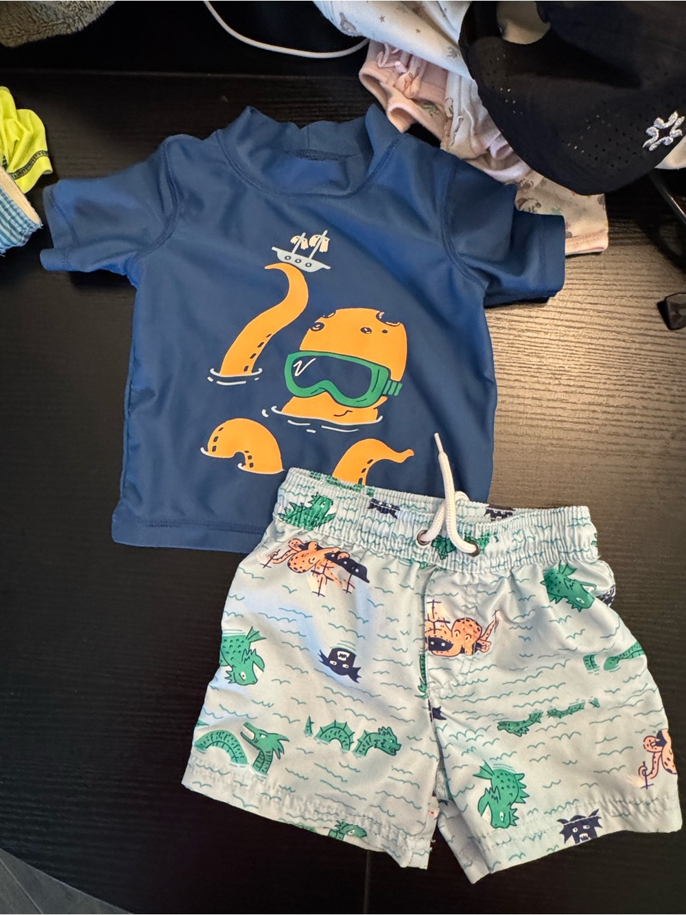 Carter's Blue Rash Guard and Light Blue Swim Shorts with Orange Octopus